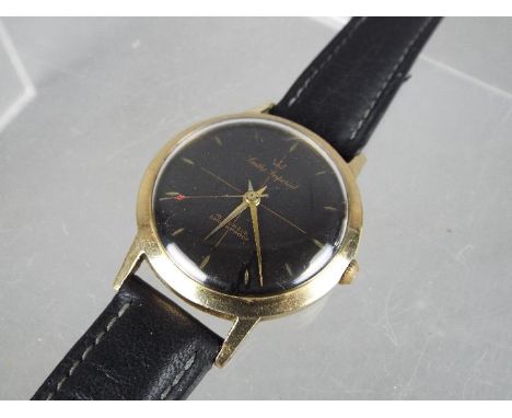 A gentleman's, yellow metal, Smiths Imperial wristwatch with black dial and 19 jewel movement, case diameter approximately 3.