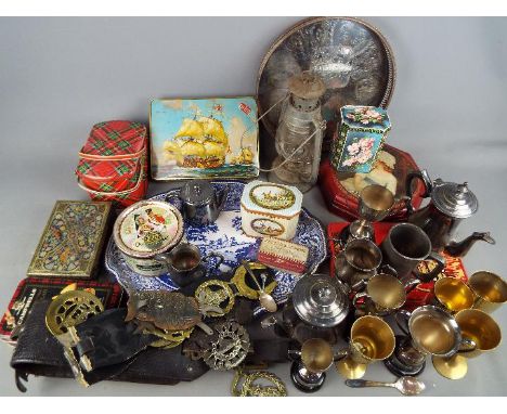 A quantity of metalware comprising plated, horse brasses, vintage tins and similar.