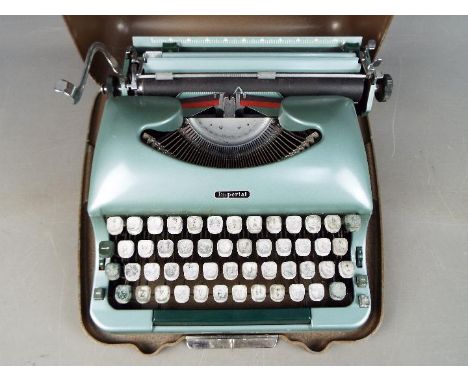 An Imperial 'Good Companion 5' portable typewriter in metal case.
