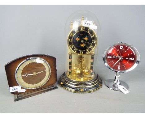 A Kundo anniversary clock, a Westclox Big Ben repeater alarm clock and one other. [3]
