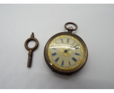 A Swiss silver cased lady's fob watch, 935 fineness, floral and foliate engraved case, white enamel dial with gilt accents an