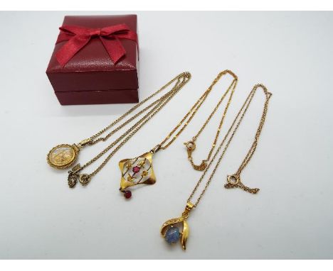 A yellow metal (unmarked) necklace with a 9ct gold pendant with stone set centre, a yellow metal (unmarked) necklace with pen