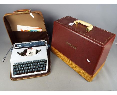 A vintage Singer 185K sewing machine in case and an Imperial portable typewriter, also cased. [2]