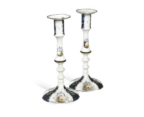 A pair of South Staffordshire metal mounted enamel candlesticks, circa 1770,the knopped stems made in two sections, on shaped