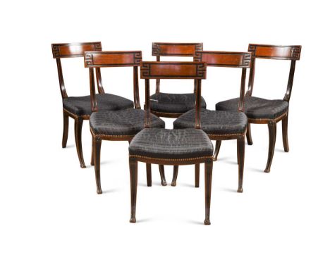 A set of six Regency mahogany dining chairs,with Greek key pattern toprail and horse hair close button seat on sabre legs85 x