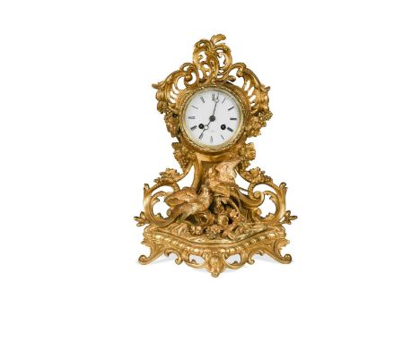 A French gilt metal and ormolu mantel clock by Henry Marc a Paris,in Rococo style, modelled with two birds amongst foliage, o