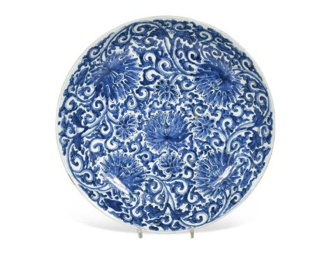 A Chinese blue and white porcelain lotus dish, Qing Dynasty, Kangxi (1662-1722),richly painted with luxuriant scrolling lotus