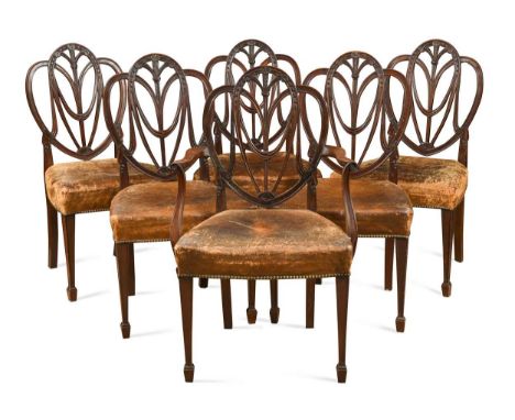 A set of six mahogany dining chairs, late 19th century,with pierced splat carved with falling drapes above close button back 