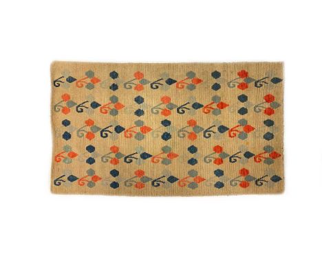 A Tibetan Khaden, early 20th century,enriched with lotus buds wool warp, wool weft, organic dyes, 82 x 152cmCondition report: