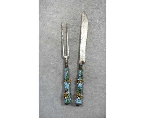 An enamel handled knife and fork, 18th century,the steel tools with relief enamelled foliate handlesthe knife 18.5cm longProv