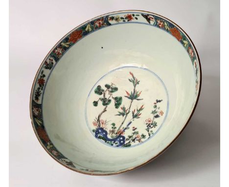 A Chinese famille verte porcelain bowl, Qing Dynasty, Kangxi (1662-1722),externally with two kylin and two phoenix amongst sh