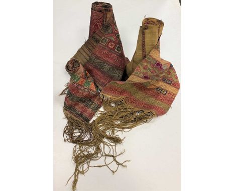 A group of three Kera, Bhutan, early 20th century,each woven with a double faced brocade technique in raw silk on cotton with