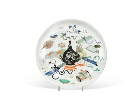 A Chinese famille verte porcelain shallow dish, Qing Dynasty, Kangxi (1662-1722),painted with a prunus vase surrounded by Bud