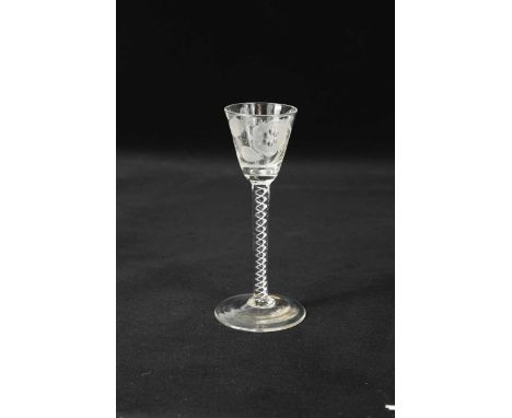 A George II Jacobite wine glass, circa 1750,the round funnel bowl engraved with a six petalled rose and a single bud, a butte