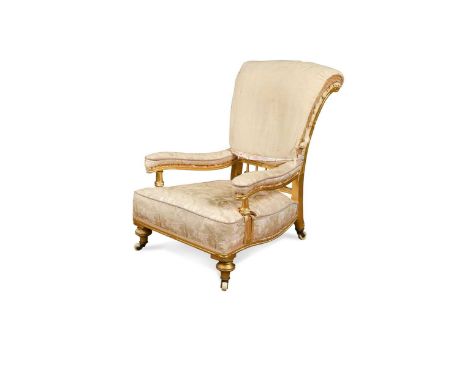 A late Victorian gilt and gesso library chair, circa 1870,the flared scrolling back incorporating a row of spindles, with gen