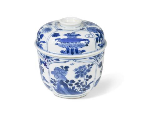 A Chinese blue and white bowl and cover, Qing Dynasty, Kangxi (1662-1722),decorated with panels of precious objects and flowe