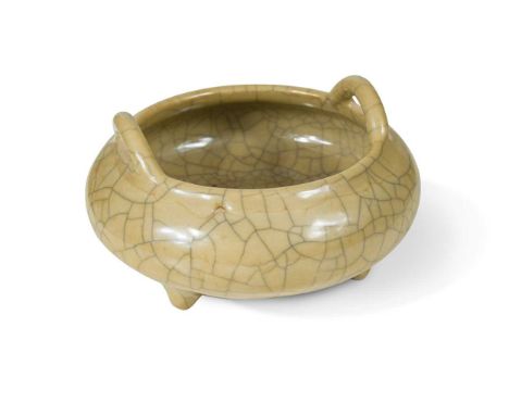 A Chinese crackle glazed porcelain censer, Qing Dynasty, 19th century,with fawn glaze, of circular cushion shape with arched 