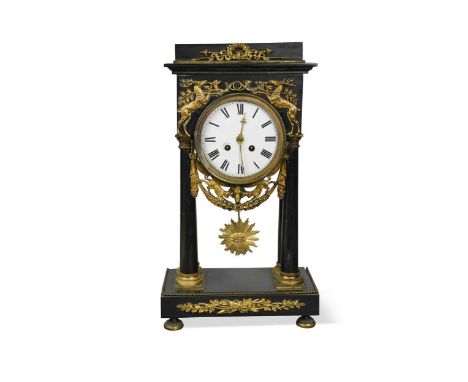 An Empire style gilt metal mounted black marble mantle clock, late 19th century,the portico case with 12cm dial, sunburst pen