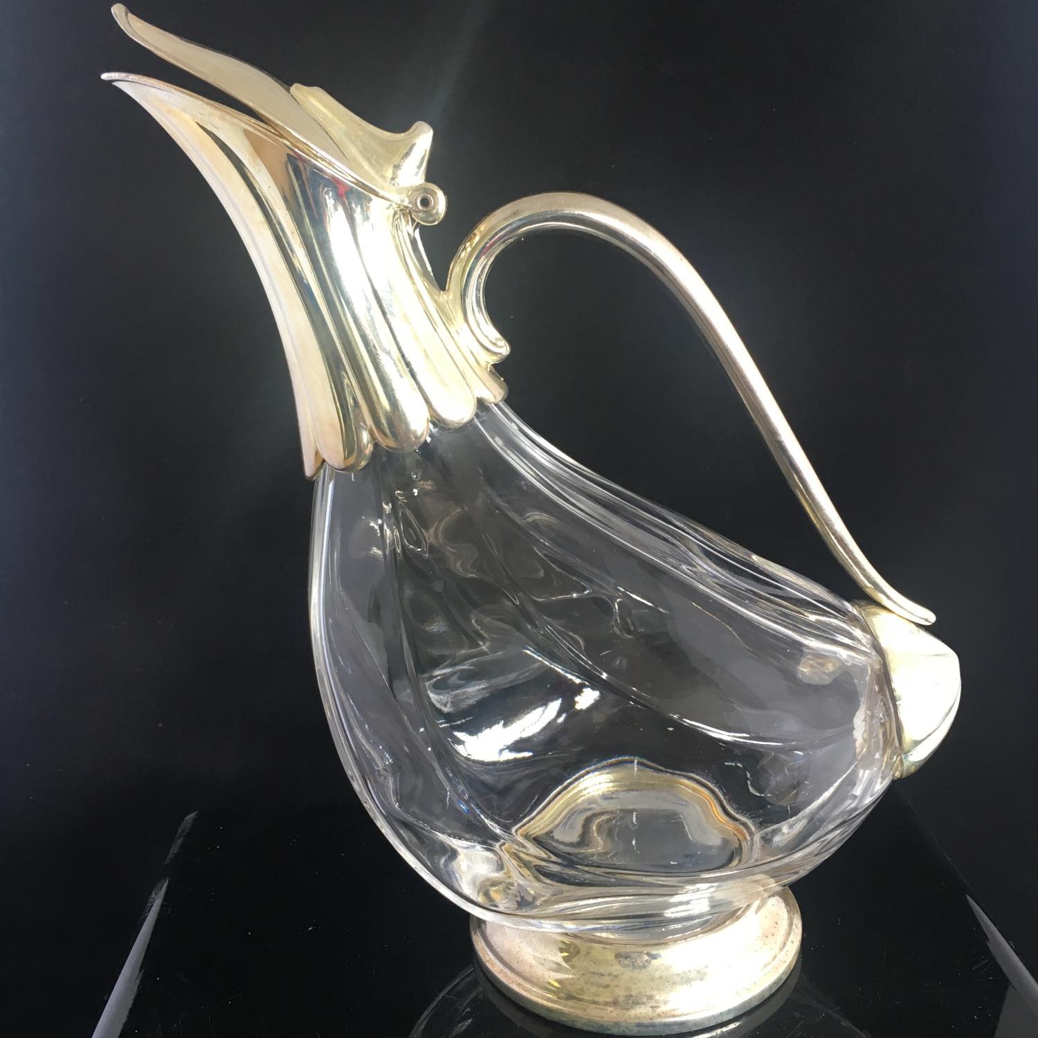 SILVER PLATED AND GLASS DUCK SHAPED WINE DECANTER. In good overall