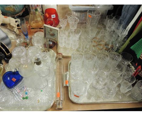 LARGE QUANTITY OF MIXED GLASS, mostly drinking glasses and ornamental pressed / cut glass
