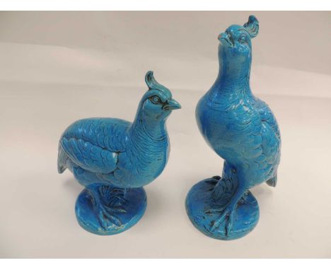 TWO CONTINENTAL TURQUOISE CERAMIC MODEL BIRDS, in the Chinese style, tallest 29cms (h) 