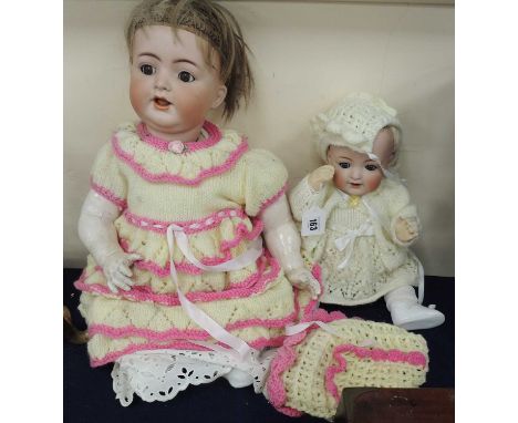 TWO BISQUE HEADED DOLLS comprising a Simon and Halbig bisque headed baby doll and a Kammer &amp; Reinhardt/Simon and Halbig b