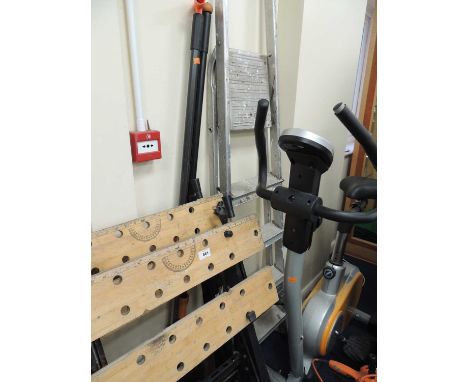 TWO WORKBENCHES, folding aluminium step ladders, exercise bicycle, tree pruner, wood axe, etc.