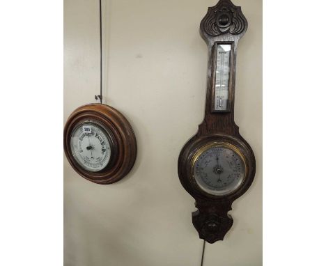 VICTORIAN OAK CASED ANEROID BAROMETER, and a further oak cased aneroid barometer (2)Provenance: private collection Cheshire