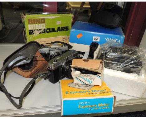 YASHICA 66 TWIN LENS REFLEX CAMERA, with original box, and Canon, Canonet, and Praktica L2 cameras, other accessories, and a 