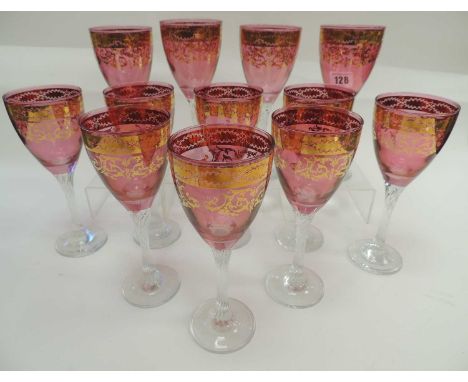SUITE OF TWELVE BOHEMIAN CZECH ROSE-TINTED WINE GLASSES, with clear glass stems