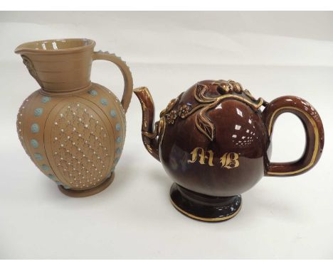 DOULTON LAMBETH SILICON STONEWARE JUG, with masked spout, and a Rockingham style treacle glazed and gilded Cadogan teapot, wi