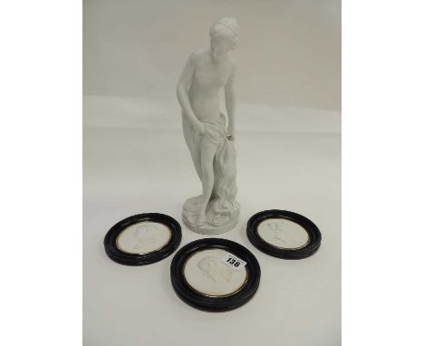 PARIAN FIGURE OF A MAIDEN, against a leafy trunk, 30cms (h), together with three circular relief parian profile portrait meda
