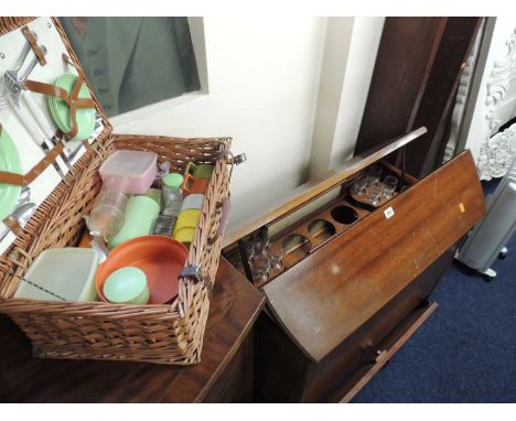 LATE 1950s / 60s RISE & FALL DRINKS CABINET and wicker picnic hamper (2)Provenance: private collection Cheshire