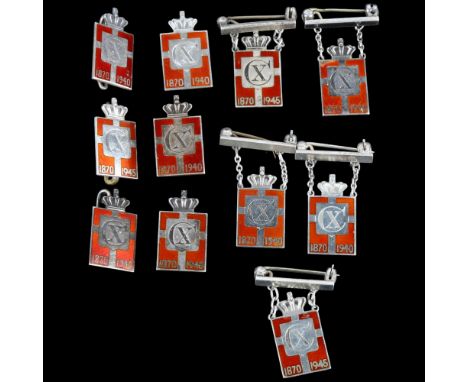 GEORG JENSEN - 11 Danish sterling silver and red enamel Kingmark badges and brooches, 33.6mm, 41.2gA few small enamel chips a