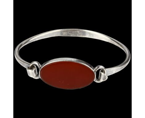 NIELS ERIK FROM - a Danish modernist sterling silver and carnelian torque bangle, model no. 13, setting height 15.3mm, intern
