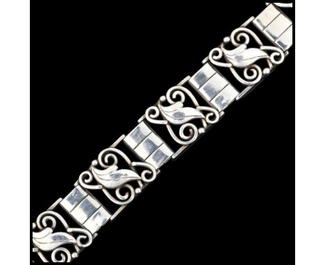 C A CHRISTENSENS - an Art Deco Danish stylised silver floral panel bracelet, 19.5cm, 35.3gNo damage or repair, only light sur
