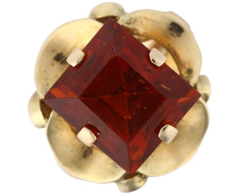 A late 20th century hessonite garnet dress ring, unmarked gold set with 9ct rectangular step-cut garnet, garnet weight calcul