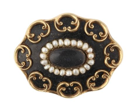 A Victorian black enamel and split pearl mourning brooch, central moire silk panel beneath convex glass within row of pearls 