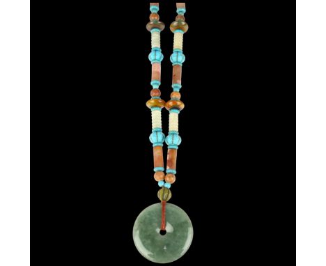 A large Chinese jade and serpentine bi disc necklace, diameter 55.2mm, necklace 70cm, 170gA few small edge chips otherwise no