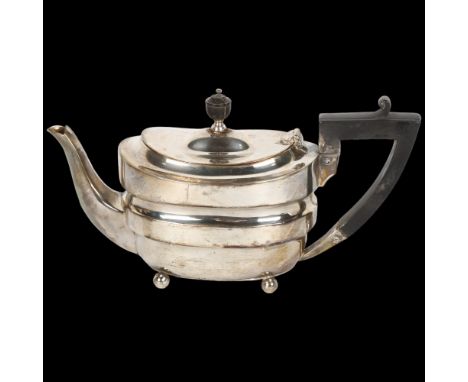 A late Victorian silver bachelor's teapot, Fordham & Faulkner, Sheffield 1898, oval waisted form, with bun feet and ebonised 