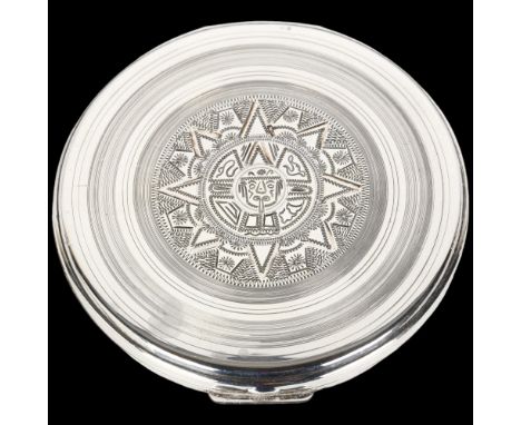 A large Mexican sterling silver compact, maker CMR, circular form with engraved Aztec decoration, 9cm, 3.9oz grossNo damage o