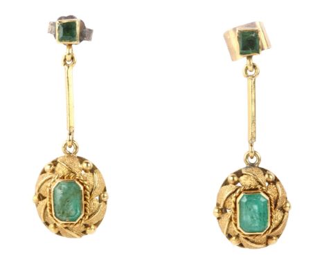 A pair of emerald drop earrings, late 20th century, rub-over set with octagonal and square step-cut emeralds, with leaf decor