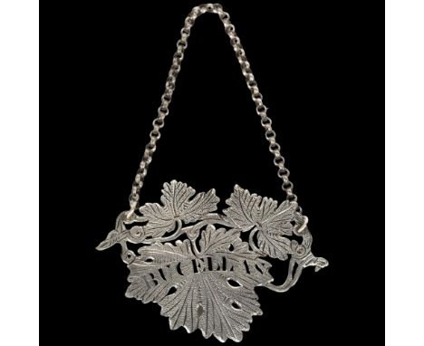 A George IV silver 'Bucellas' grapevine wine decanter label, Ledsan Vale, Birmingham 1827, width 8.5cmNo damage or repair, ha