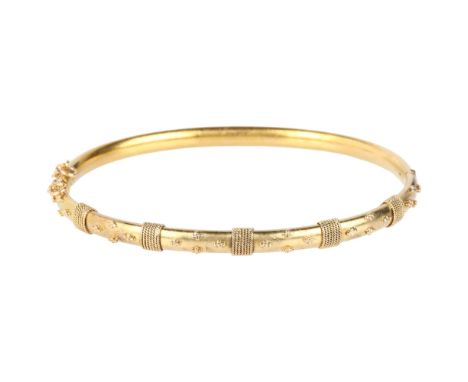 A Victorian 15ct gold Etruscan Revival hinged bangle, circa 1880, with applied rope twist and bead decoration, band width 5mm
