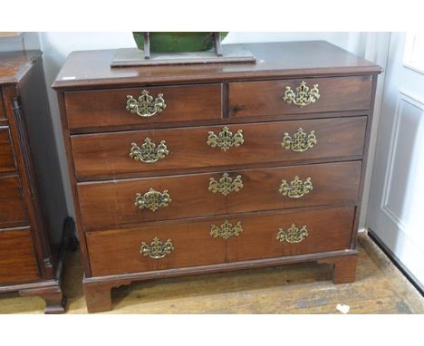 A George III mahogany chest of drawers, the rectangular moulded top above two short and three long graduated drawers and (rep