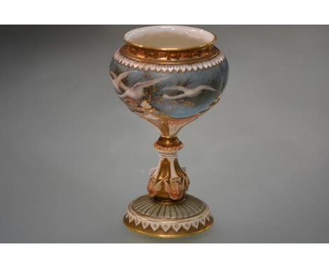 A Royal Worcester porcelain vase painted by Charles Baldwyn, characteristically decorated with swans in flight against a blue