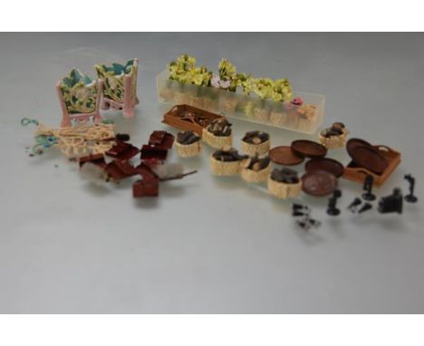 A quantity of 20th century doll's house accessories including: a group of log baskets; carpet beaters; wooden trays and hange