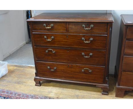 A George III mahogany chest of drawers, the rectangular moulded top above two short and three long cockbeaded graduated drawe
