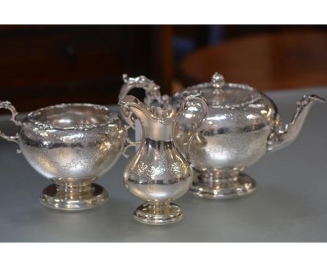 A Victorian Scottish silver matched three piece tea service, J. McKay, Edinburgh 1857 and 1858, the teapot and sugar bowl of 