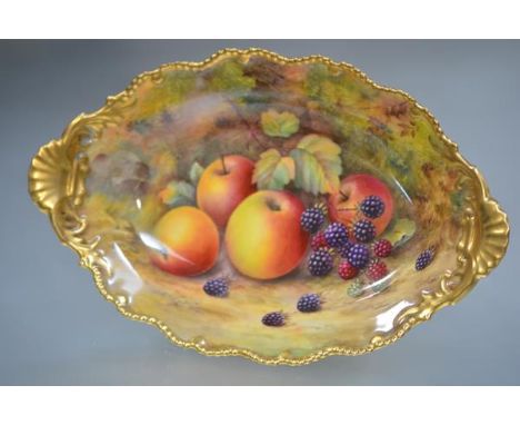 A Royal Worcester fruit-painted comport painted by Lockyer, of oval form, on a circular pedestal foot, decorated with apples 